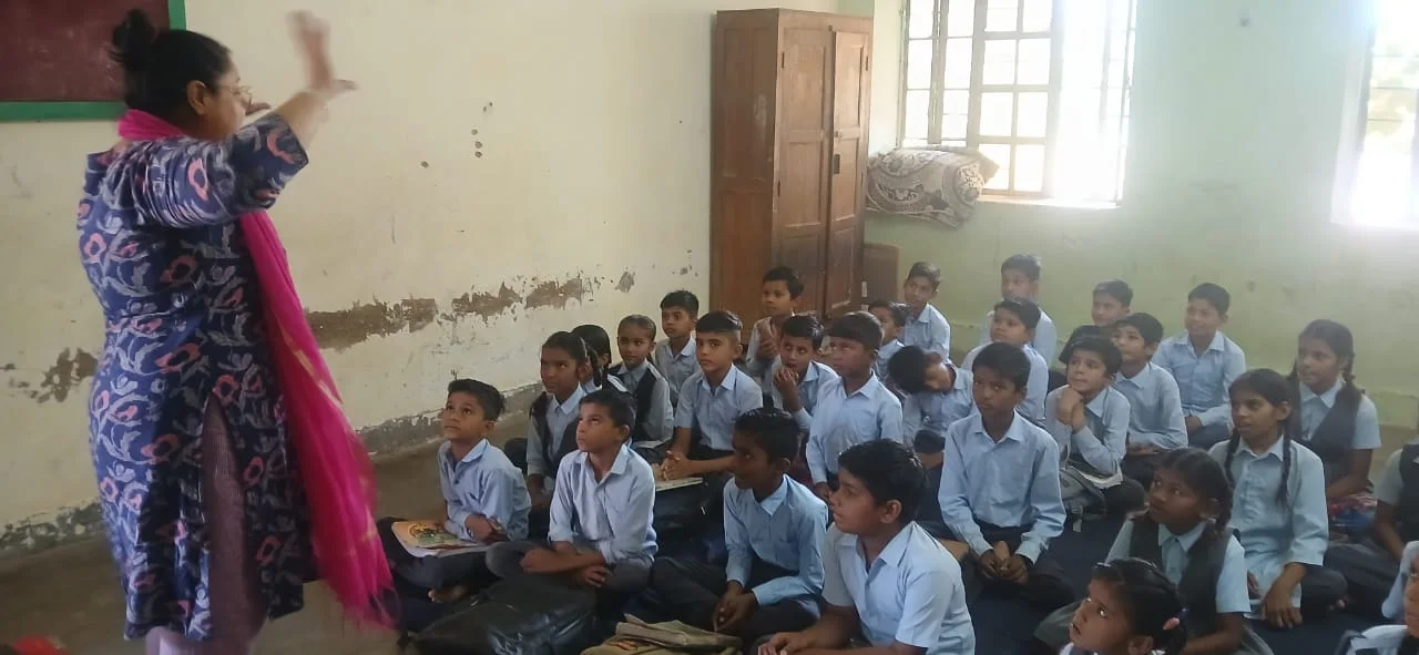 A teacher leading a classroom learning activity
