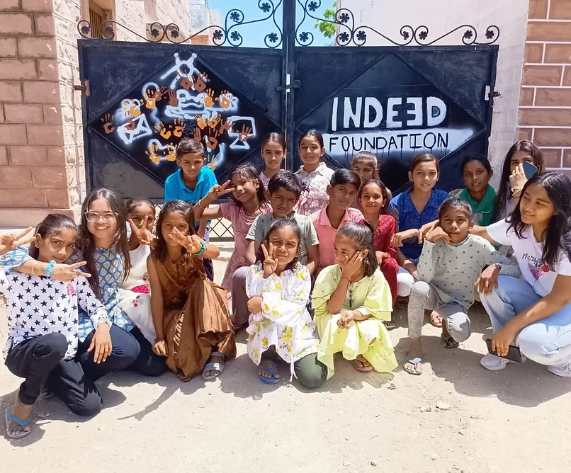 IN-DEED Foundation students and volunteers together outside the foundation