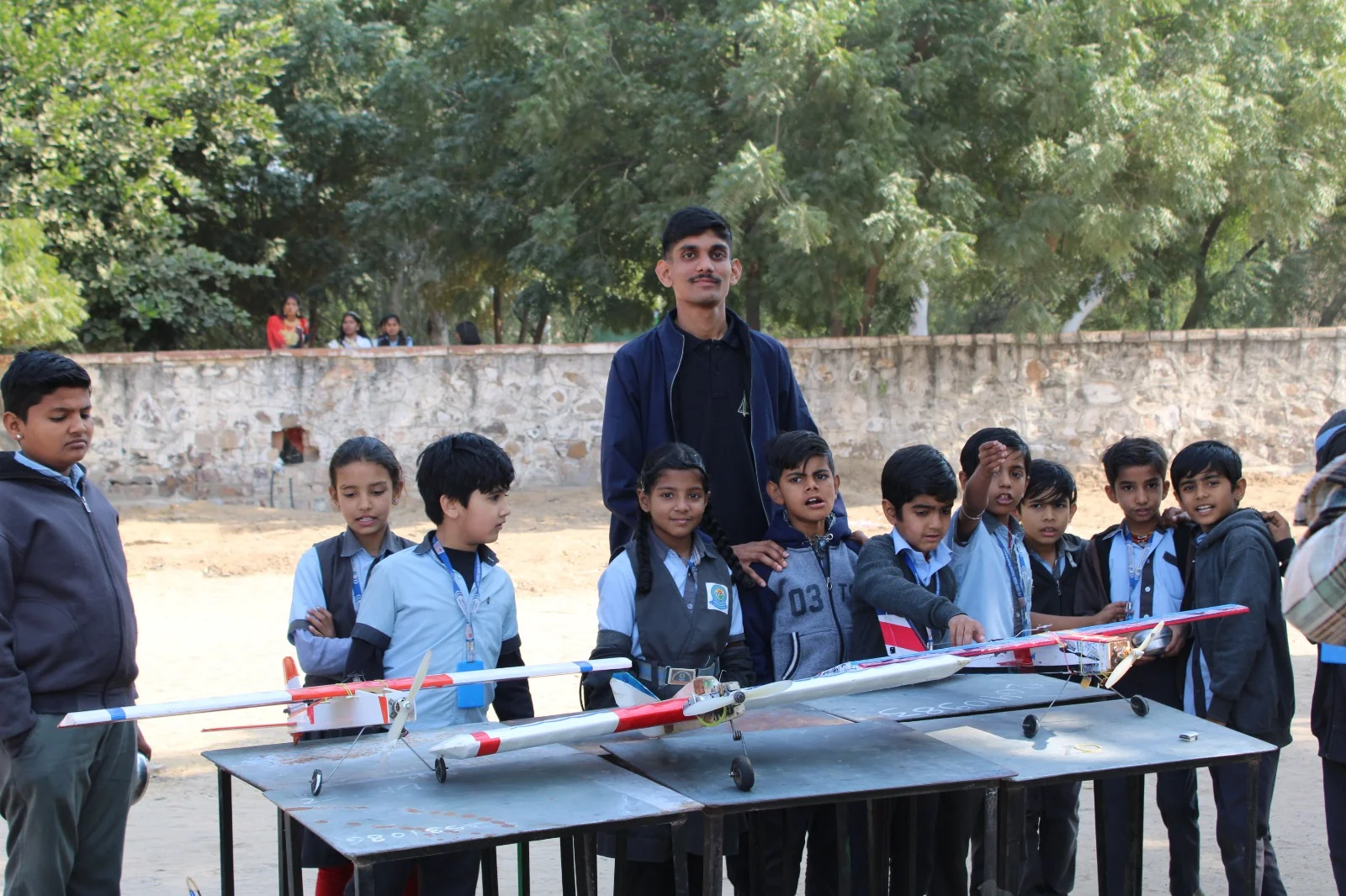 Students exploring a model aircraft demonstration