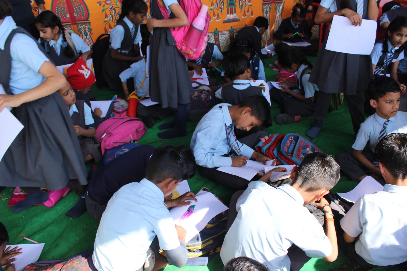 Students working together at an activity stall