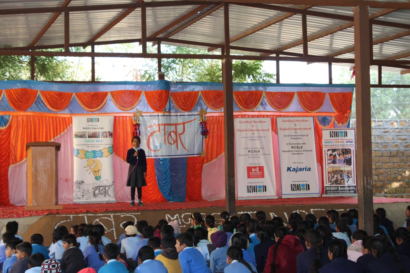A student presenting to a school audience