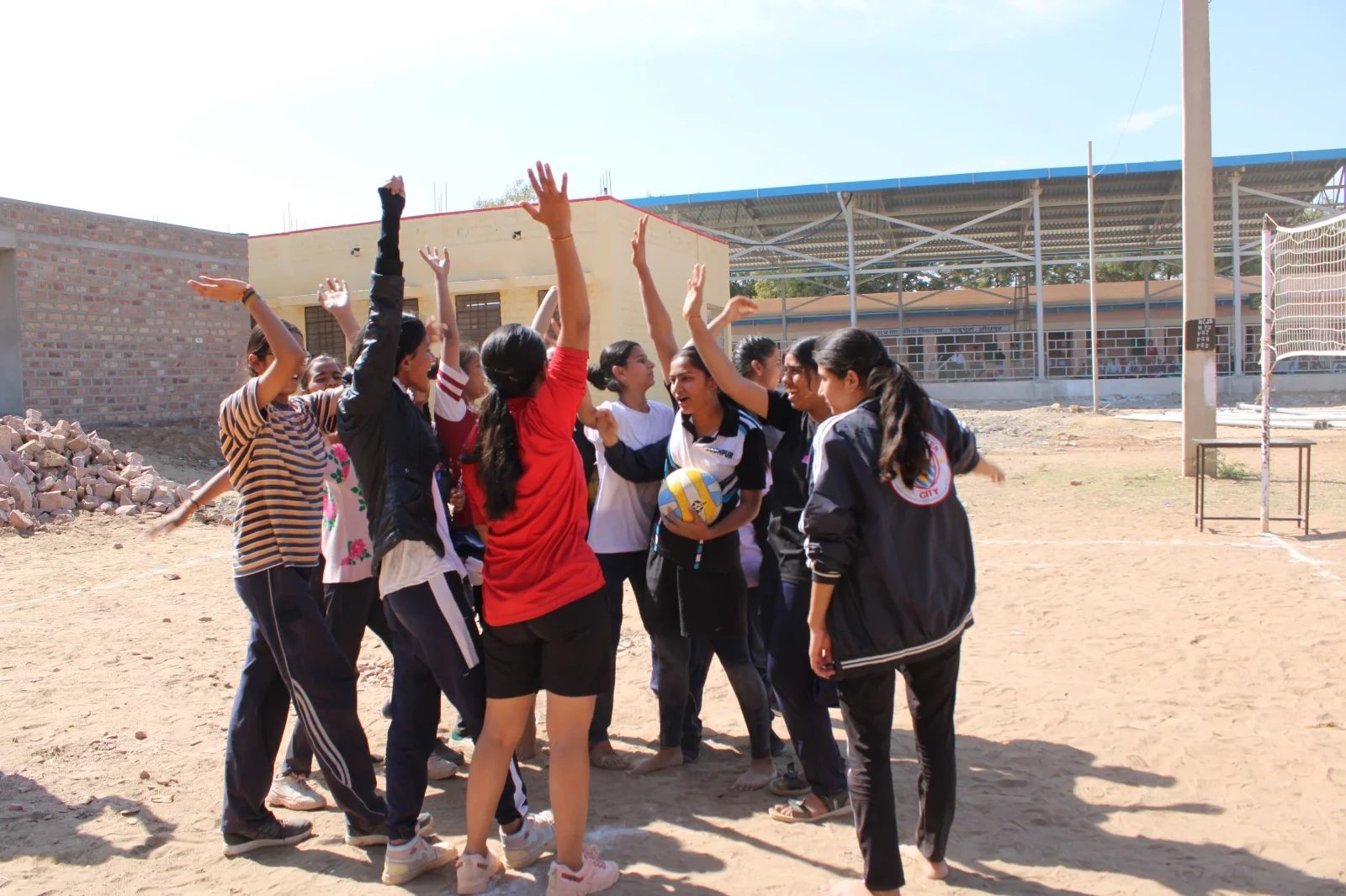 Students celebrating together on the sports ground